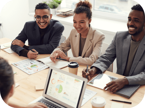 photo-of-three-people-smiling-while-having-a-meeting-3184338@2x